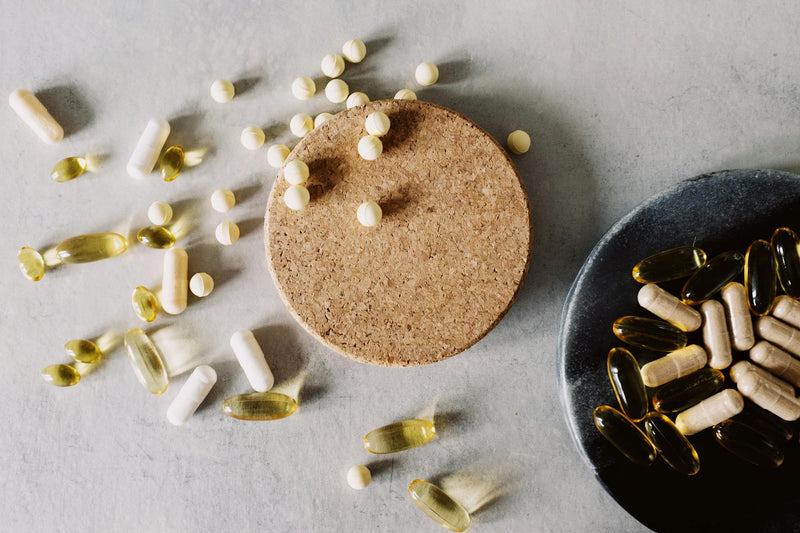 Premium wellness supplements arranged in a clean minimal health-focused display