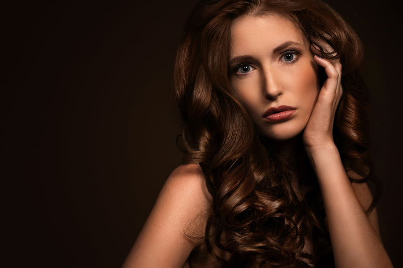 Luxury beauty and skincare essentials arranged in a minimal atelier setting