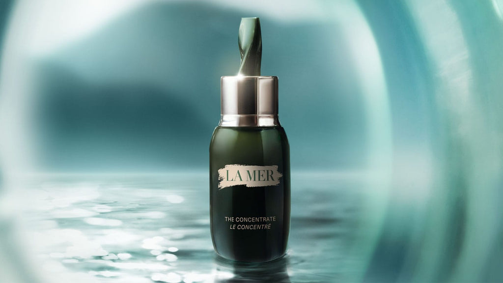 Wide view of Crème de La Mer Moisturizing Cream, White jar placed on a serene water surface, reflecting its deeply hydrating and soothing qualities for ultimate skin renewal.