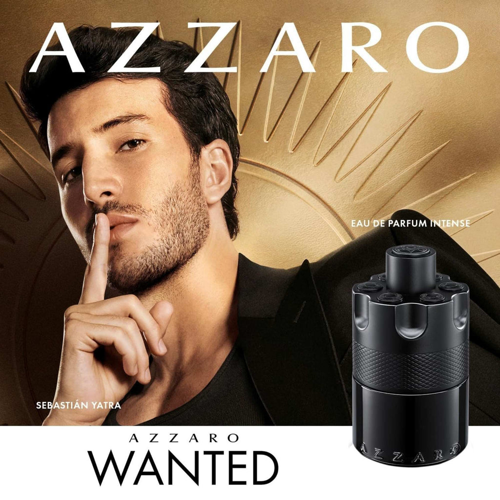 Azzaro Wanted perfume advertisement with a man and the product on a gold background