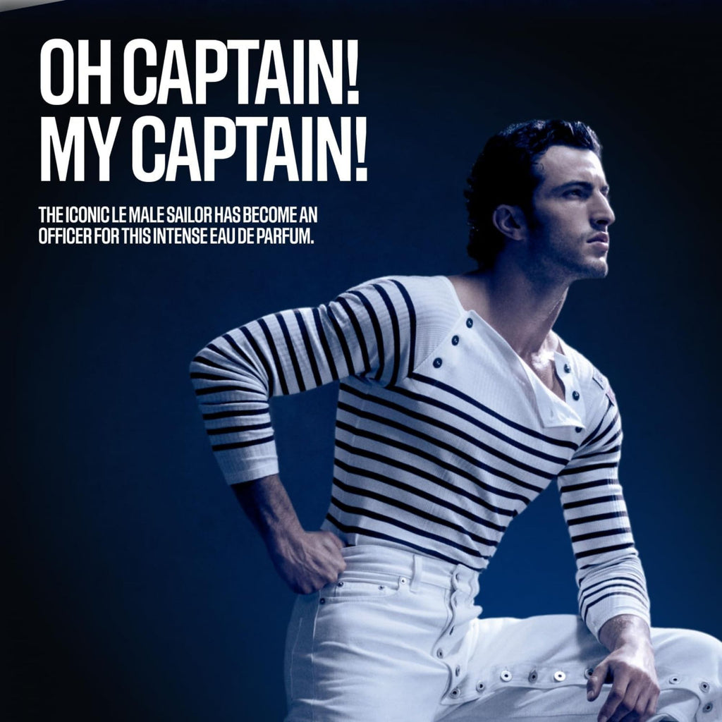 Jean Paul Gaultier Le Male Le Parfum Eau de Parfum Man in a striped shirt and white pants with text 'Oh Captain! My Captain!' on a dark background