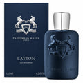 Layton Eau de Parfum bottle and its matching dark blue box by Parfums de Marly, featuring a silver-toned cap and embossed horse crest with the number 1743.