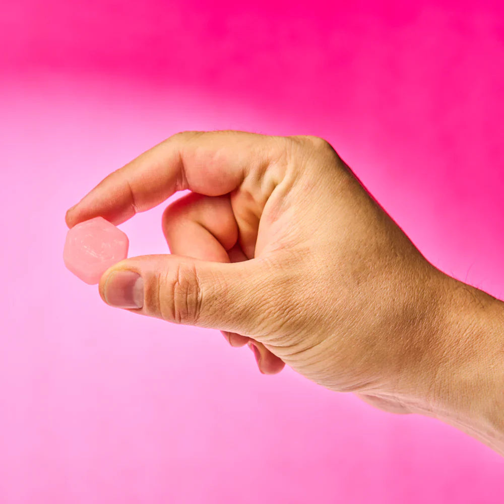 Create Creatine Monohydrate Gummies Watermelon - 90 Count. A hand holding the watermelon-flavored creatine gummies, illustrating the convenient and tasty way to consume creatine for effective muscle building and workout support.