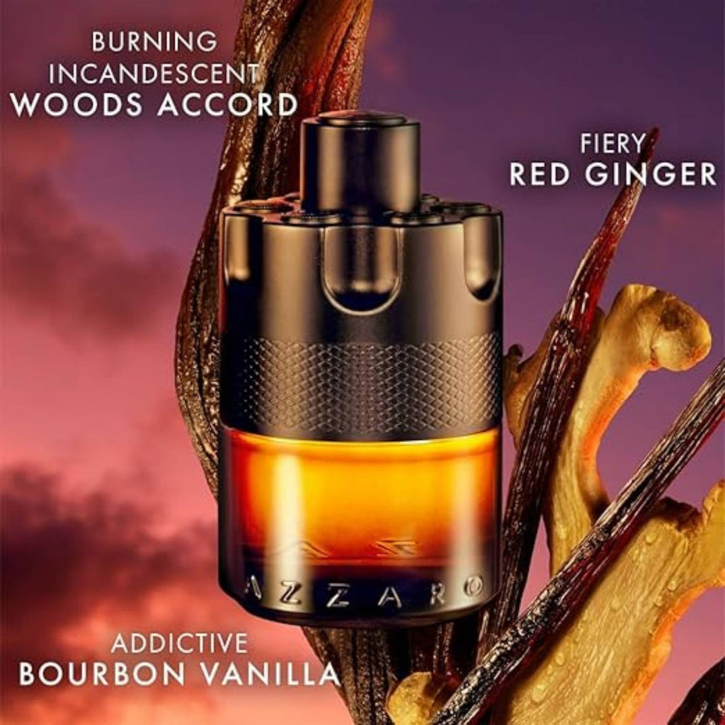 A bottle of Azzaro cologne with incandescent woods and fiery red ginger accents on a dark background.